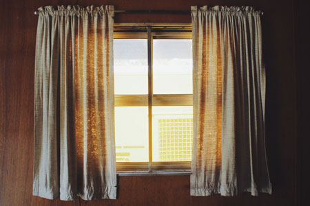 Draw curtains at night to conserve heat